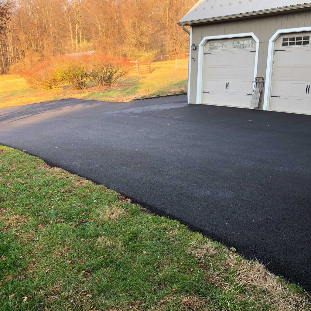 our work on paving a driveway leading up to two garages and around the side of one garage