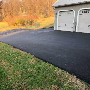 our work on paving a driveway leading up to two garages and around the side of one garage