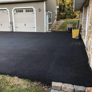 newly paved residential driveway for two two car garages