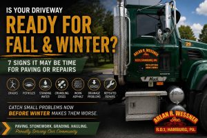 Arlan R. Wessner paving crew preparing an asphalt driveway for fall maintenance and seasonal weather conditions