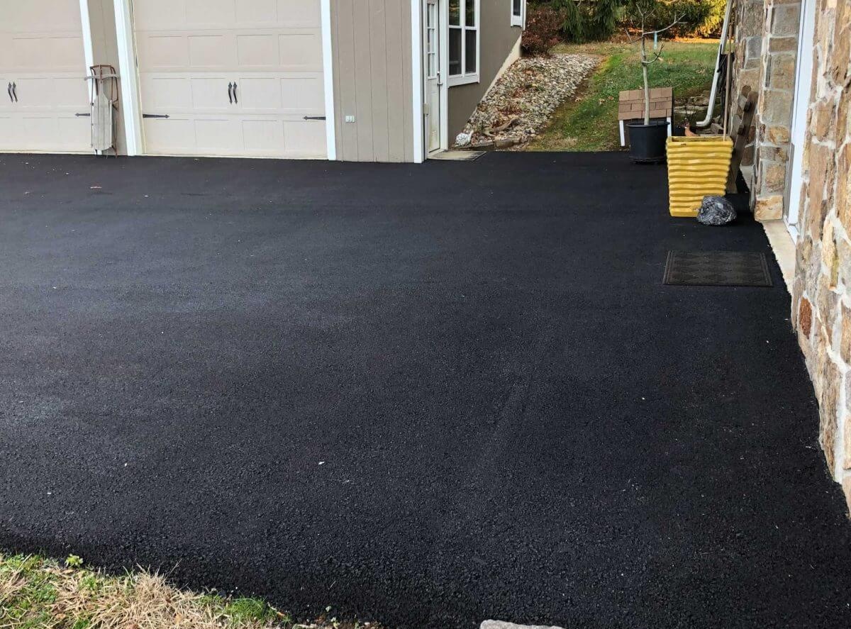 newly paved residential driveway for two two car garages